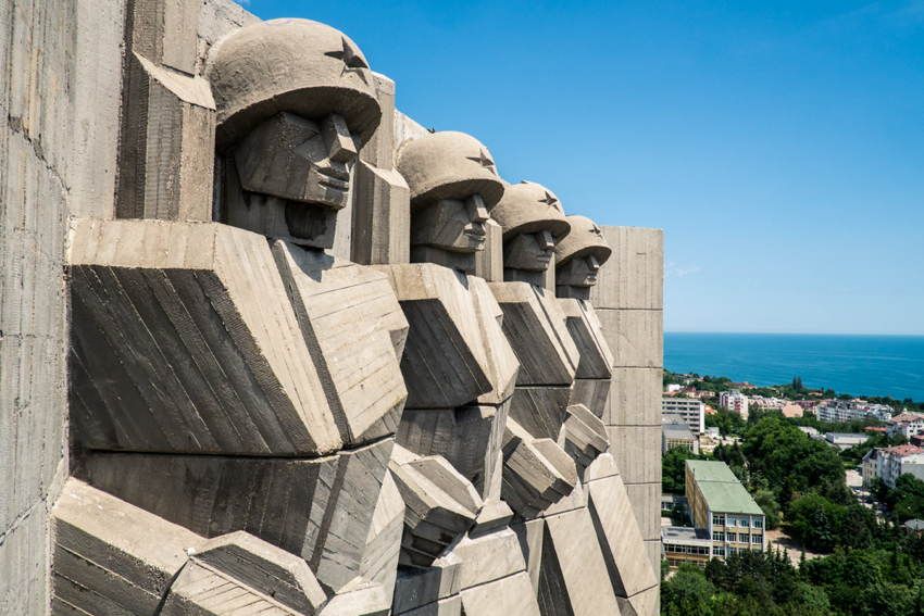 Statues decorate a wall in the old USSR.